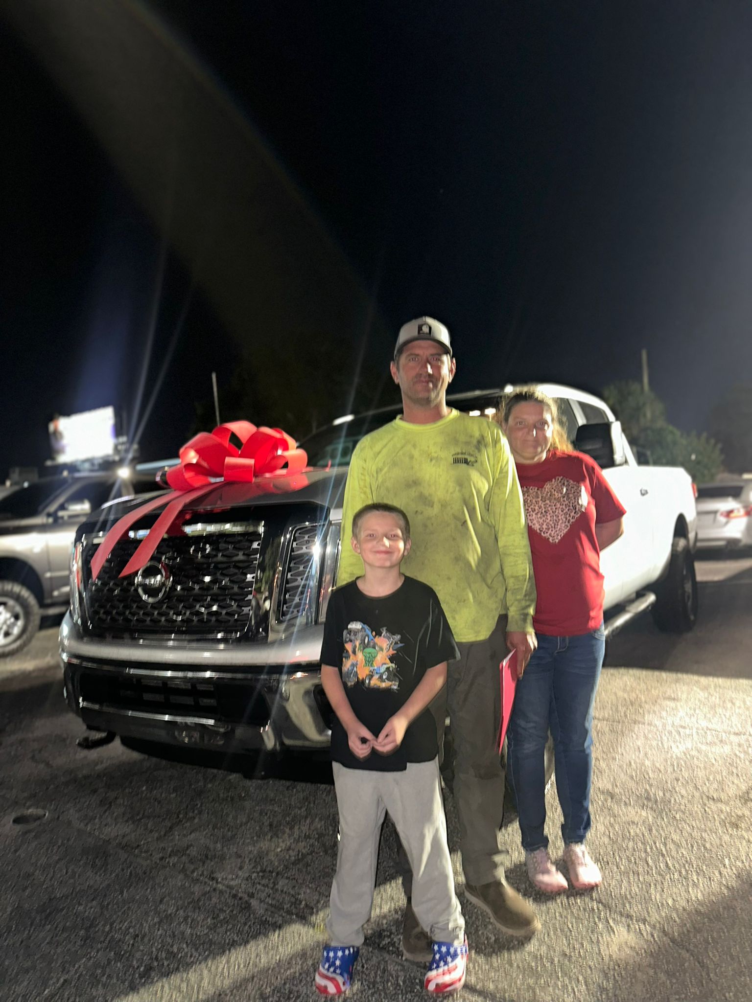 Client posing with their car